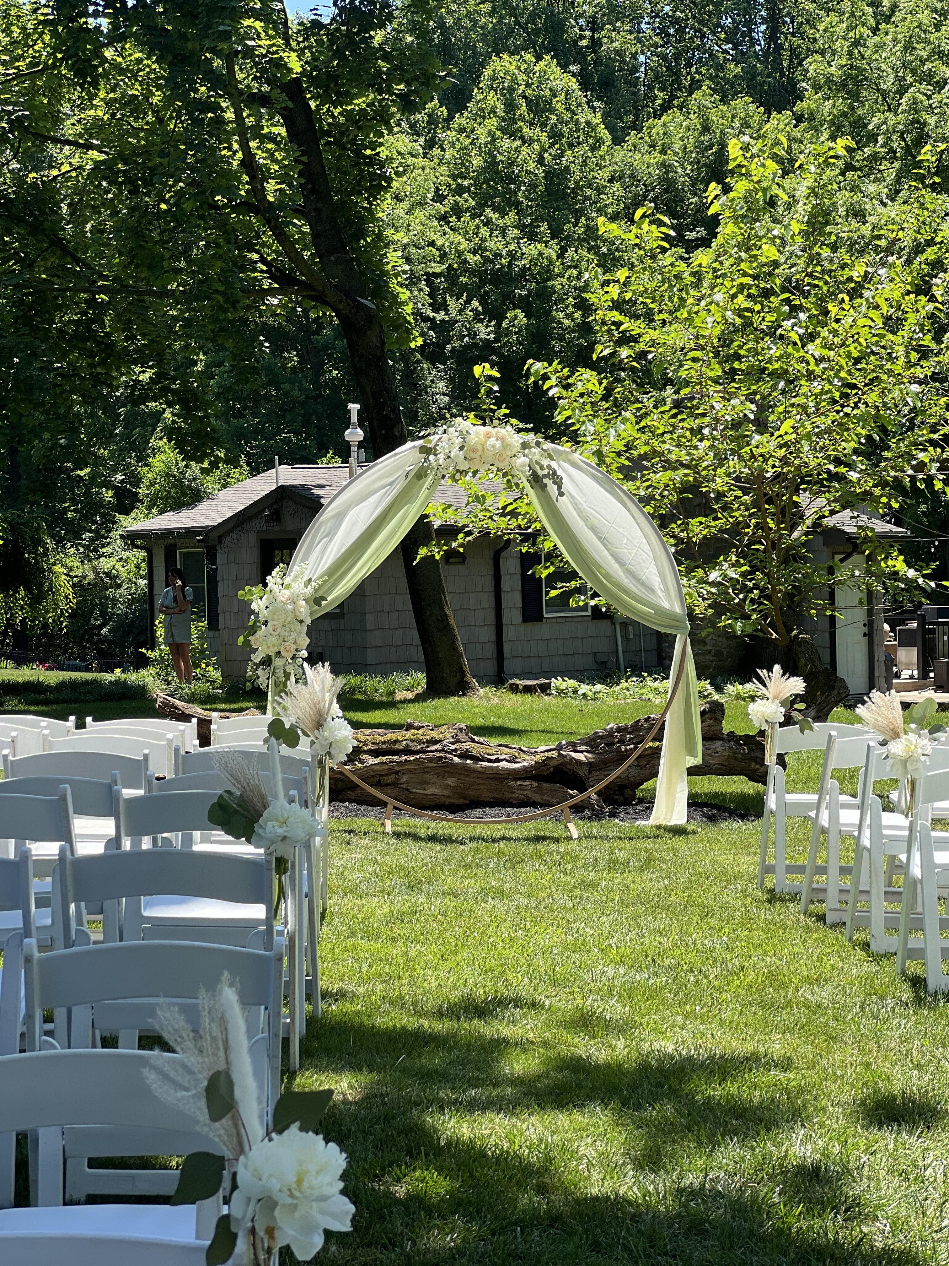 Bride and groom with beautiful floral backdrop